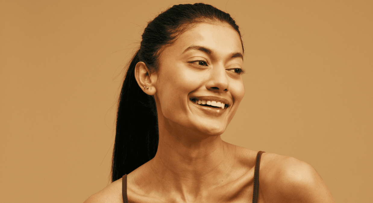 Clear youthful skin woman smiling, skincare and aesthetic treatment, Aetheria Aesthetics & Wellness.